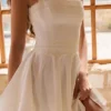 Cosette White Broderie Anglais + Cotton Halter Neck Mini Dress Cosette White Broderie Anglais + Cotton Halter Neck Mini Dress