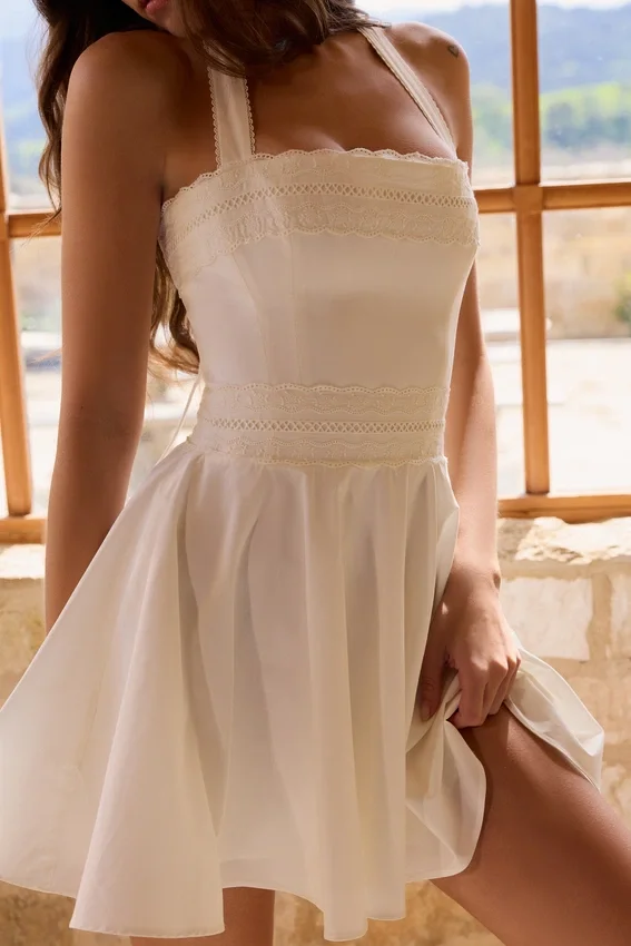 Cosette White Broderie Anglais + Cotton Halter Neck Mini Dress Cosette White Broderie Anglais + Cotton Halter Neck Mini Dress