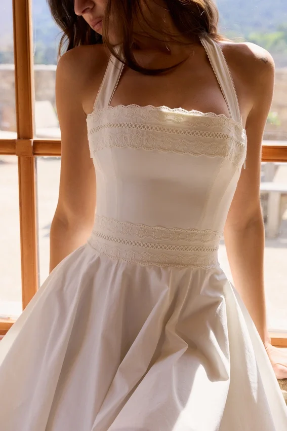 Cosette White Broderie Anglais + Cotton Halter Neck Mini Dress Cosette White Broderie Anglais + Cotton Halter Neck Mini Dress