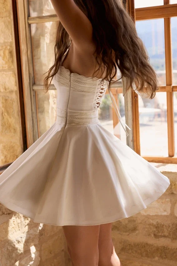Cosette White Broderie Anglais + Cotton Halter Neck Mini Dress Cosette White Broderie Anglais + Cotton Halter Neck Mini Dress