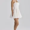 Cosette White Broderie Anglais + Cotton Halter Neck Mini Dress Cosette White Broderie Anglais + Cotton Halter Neck Mini Dress