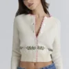 Mistle-Bow Cream Jacqard Wool Cardigan Mistle-Bow Cream Jacqard Wool Cardigan